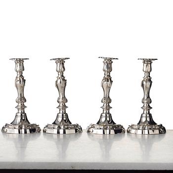 Four Louis XV mid 18th century candlesticks.