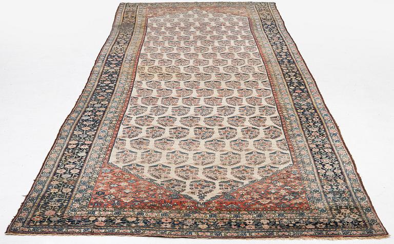 A Bakhtiari carpet, signed, c. 580 x 212 cm.
