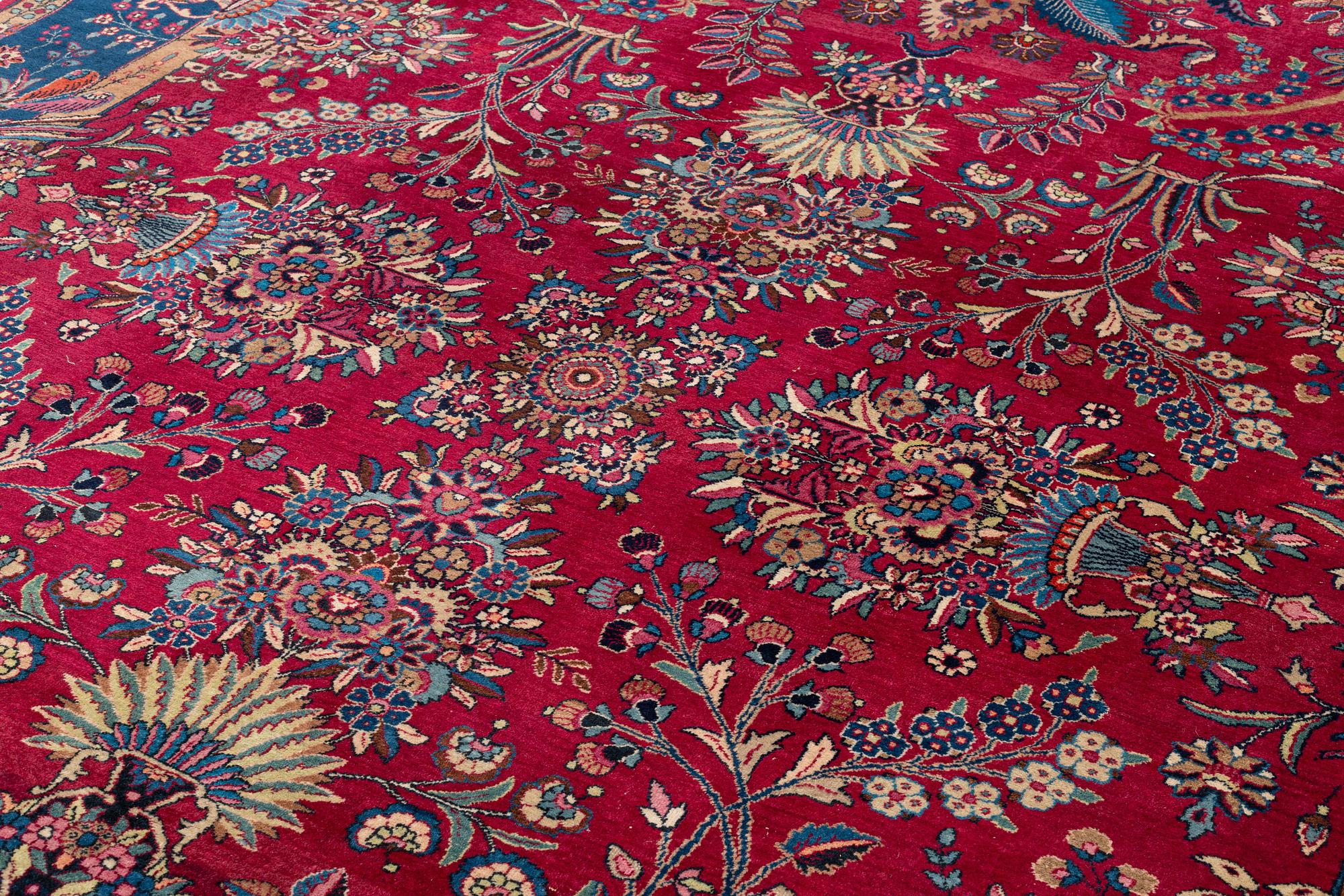 A semi-antique Mashad carpet, northeastern Persia, c. 404 x 307 cm.