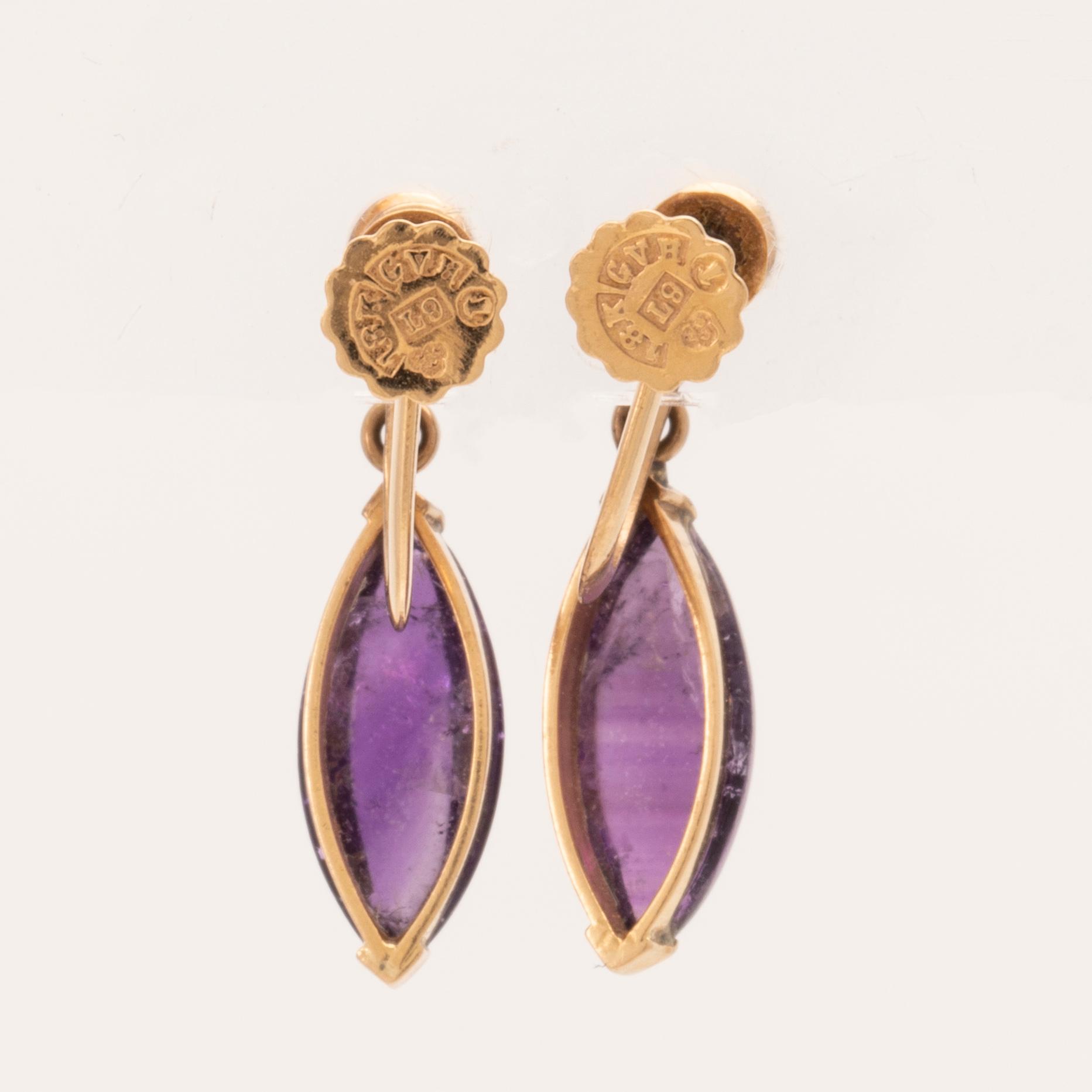 A pair of 18K gold earrings set with cabochon-cut amethysts and seed pearls, Stockholm 1961.