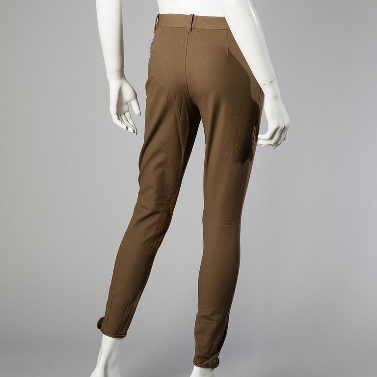 Three pair of trosers by Ralph Lauren.