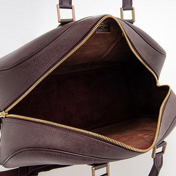 Louis Vuitton, 'Taiga Kendall PM' Bag.