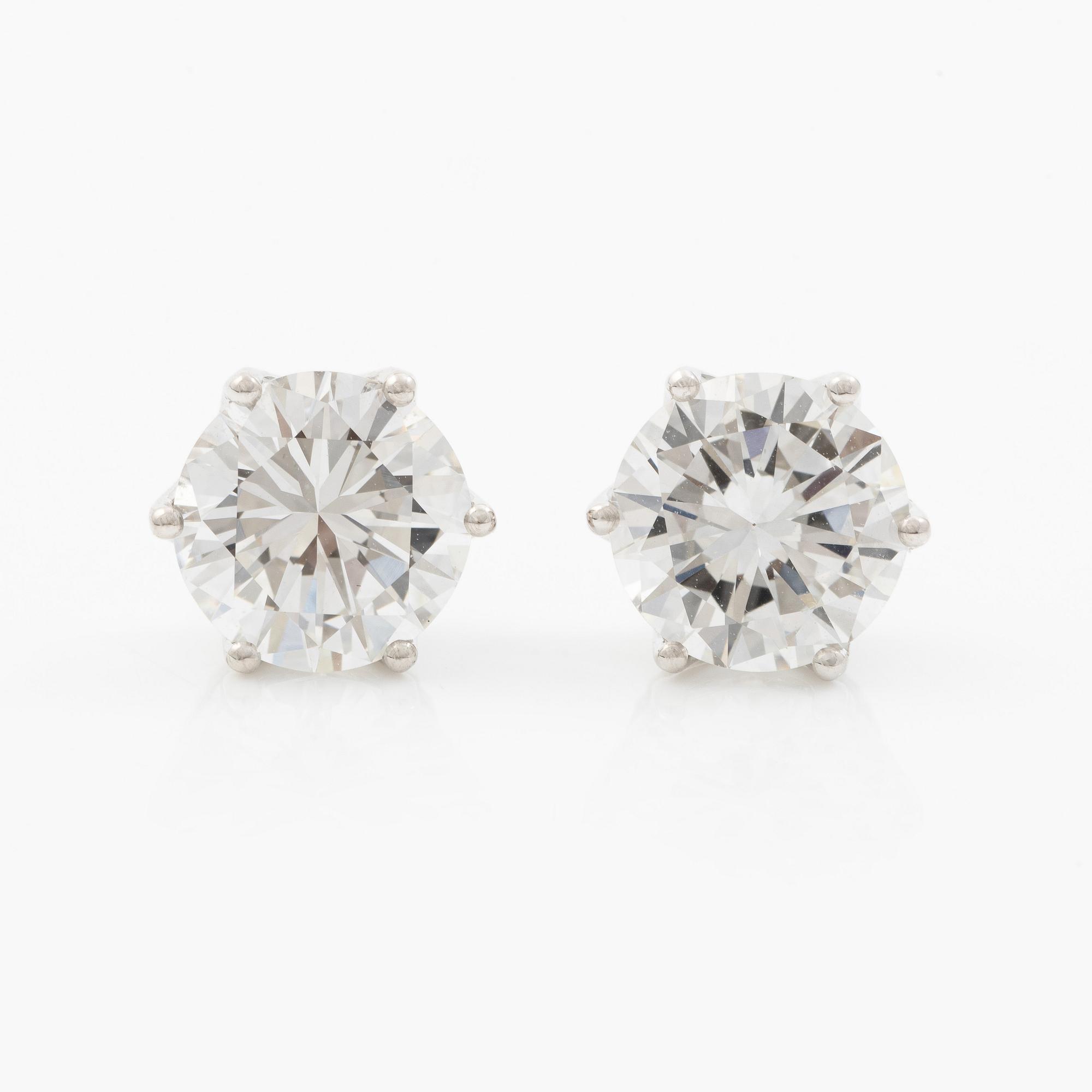 Earrings, single-stone earrings in 18K white gold with brilliant-cut diamonds, accompanied by IGI report.
