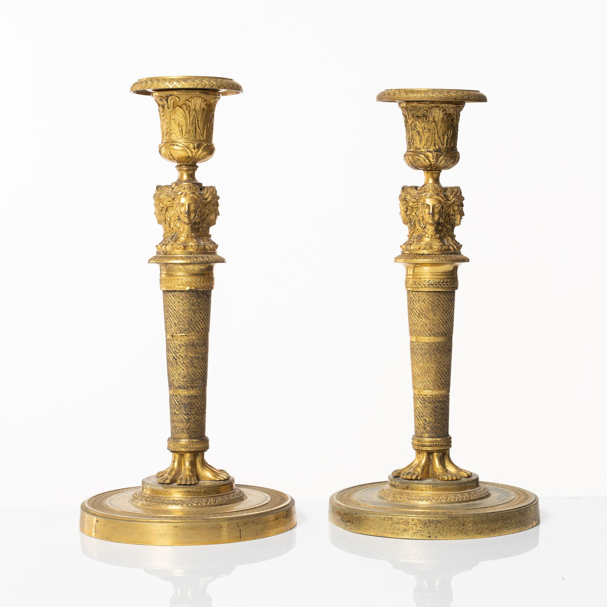 A matched pair of candlesticks, Empire, France, first half of the 20th century.