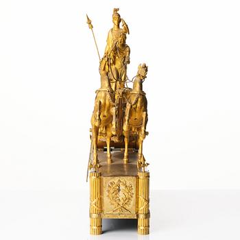 A French Empire early 19th century gilt bronze mantel clock, marked J Langlois à Paris.