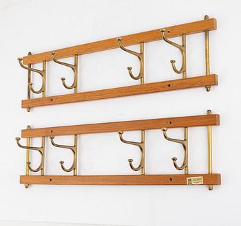 A pair of 'Dekorativ' coat hangers, Skoglunds metallgjuteri, Anderstorp, mid 20th Century.