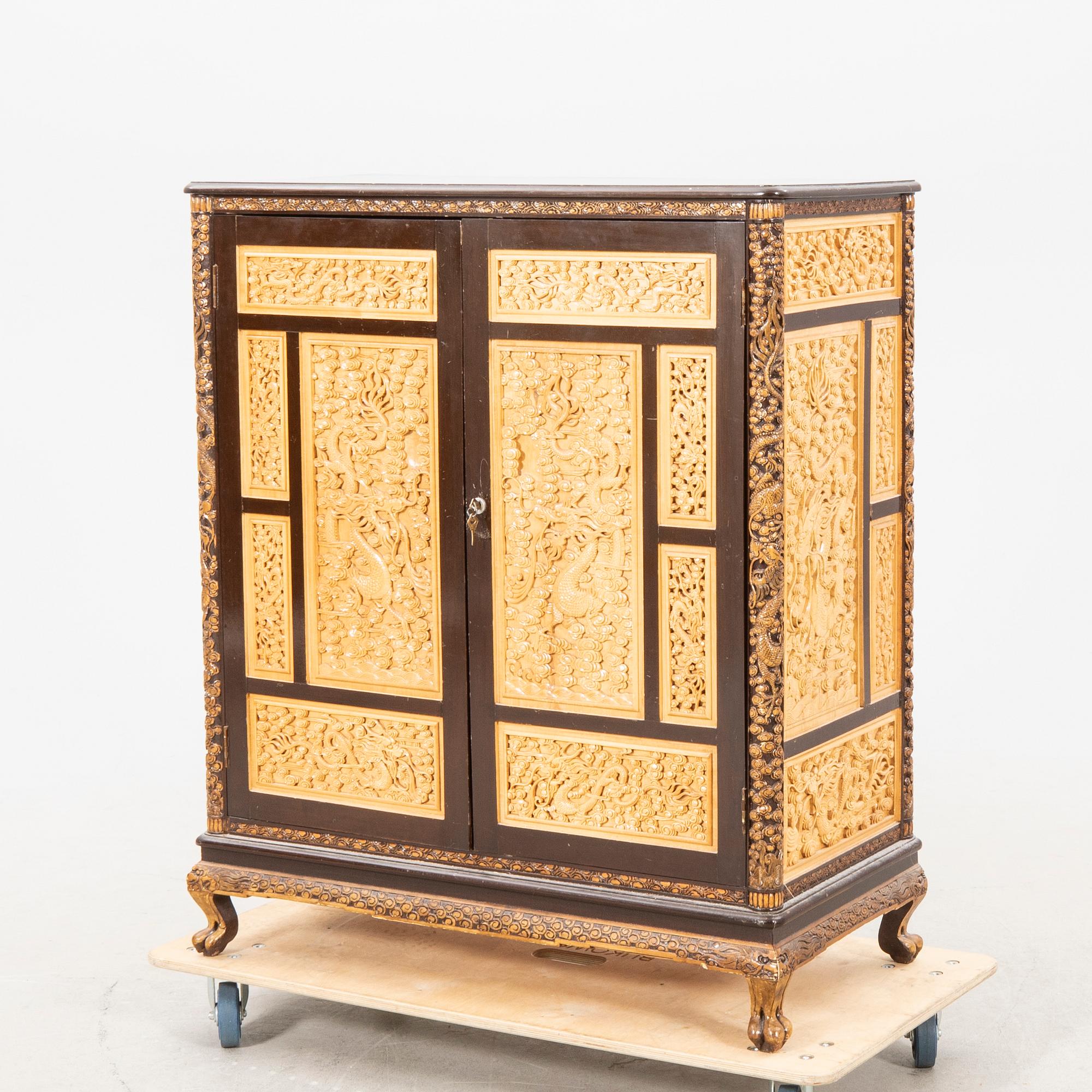 A Chinese wooden cabinet  mid 1900s.