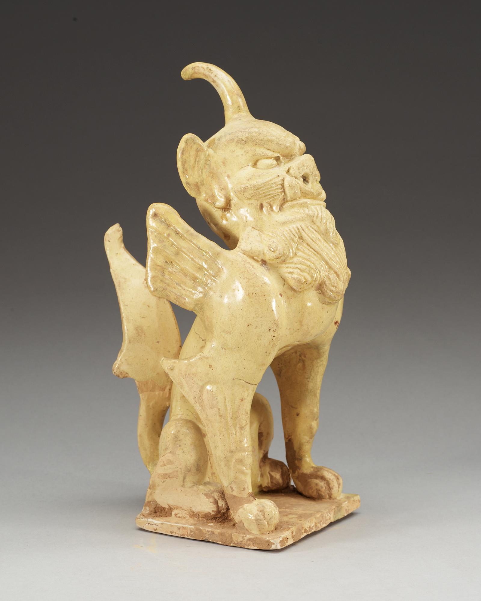 A yellow glazed pottery guardian, Tang dynasty (618-907).