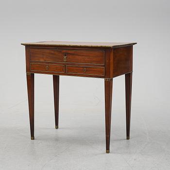 A late Gustavian mahogany tabld with drawers, end of the 18th Century.