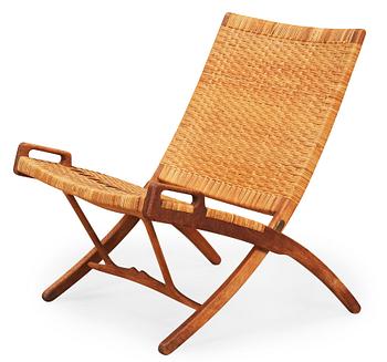 58. A Hans J Wegner oak and rattan folding chair, by Johannes Hansen, Denmark.