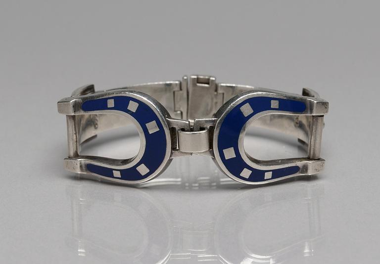 A Gucci silver bracelet.