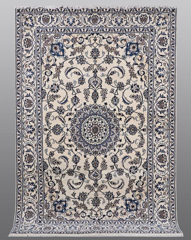 A carpet Nain, part silk, ca 290 x 196 cm.
