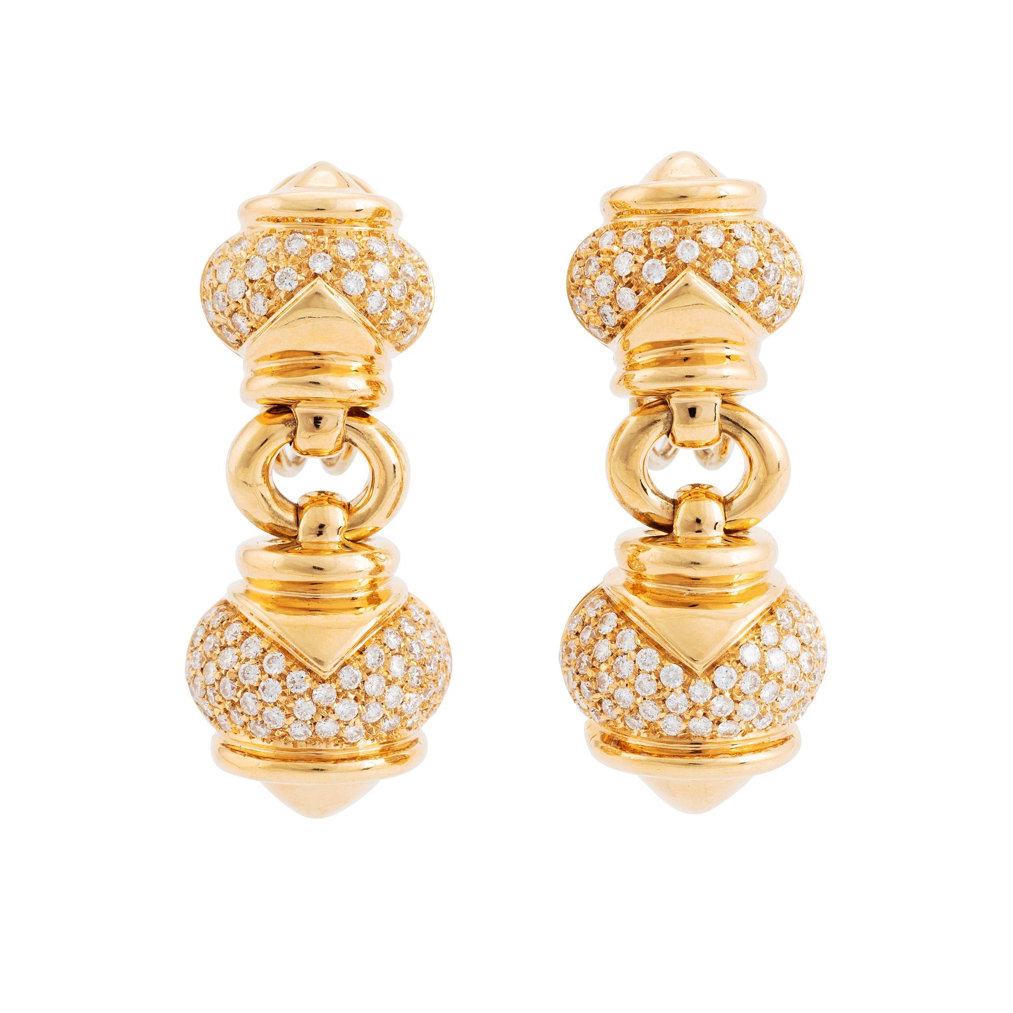 A pair of 18K gold earrings set with round brilliant-cut diamonds.