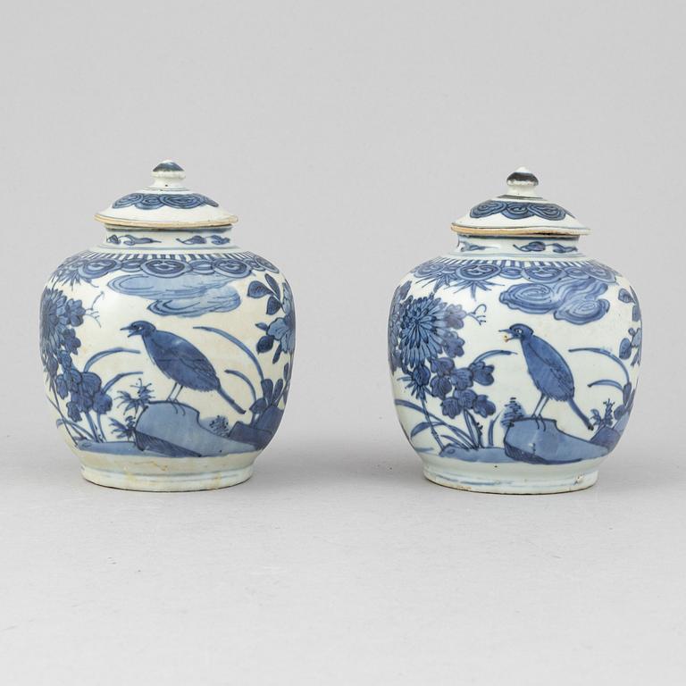 A pair of Chinese blue and white jars with covers, and one jar, Ming dynasty (1368-1644).