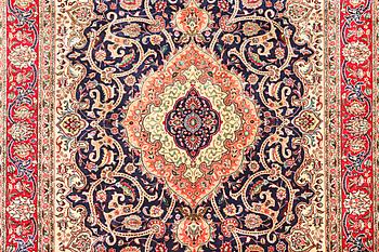 A Tabriz carpet, c. 345 x 255 cm.