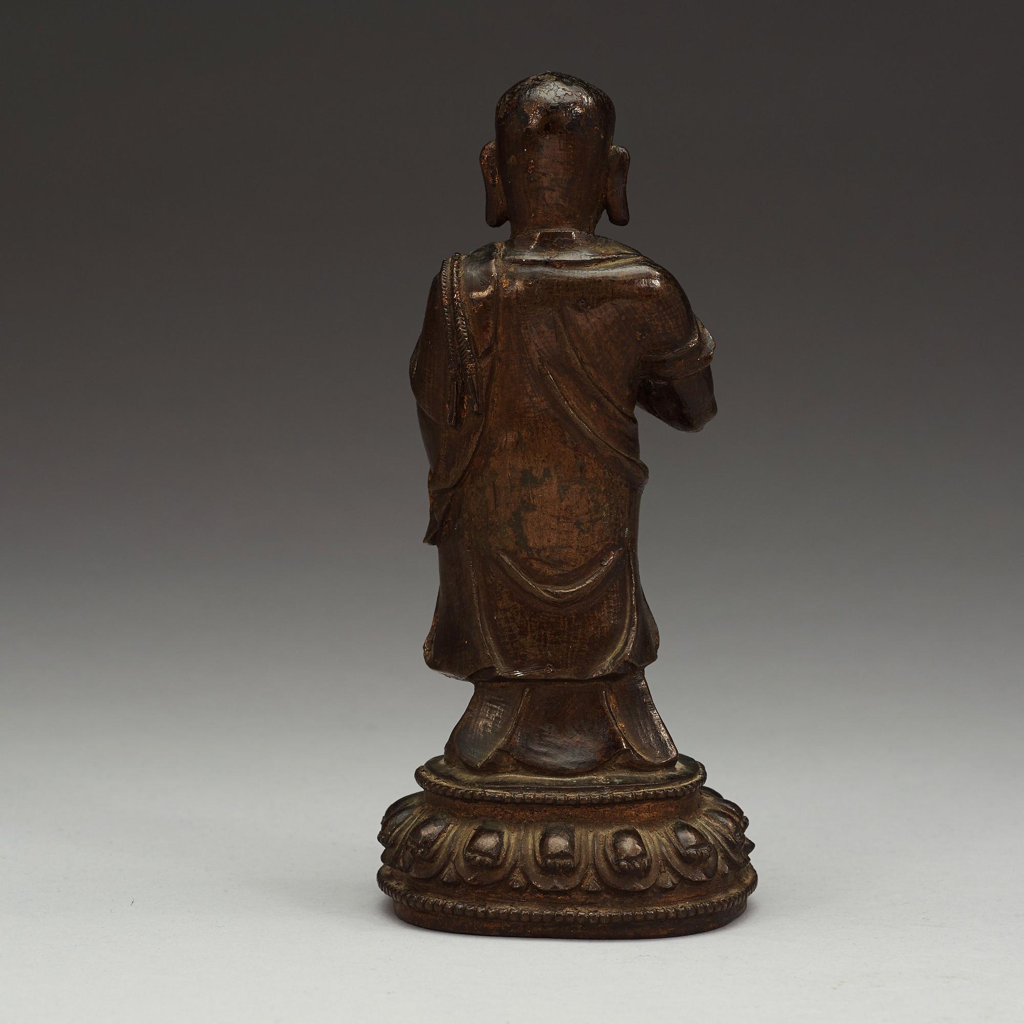 A bronze figure of a Lohan, Ming dynasty, 17th Century.