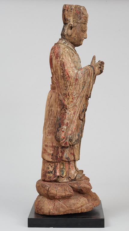 A wooden sculpture of a deity, Ming style.