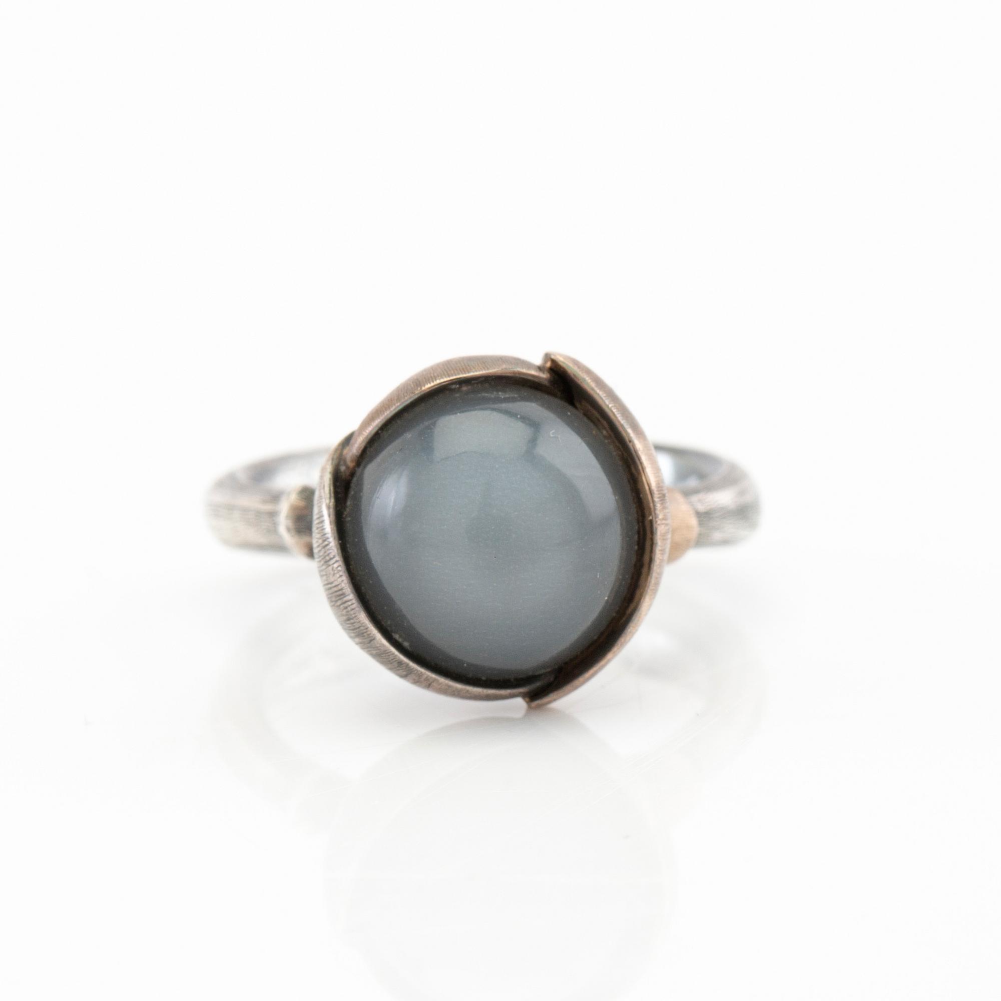 Ole Lynggaard, ring "Lotus" silver, white gold and cabochon-cut moonstone, design Charlotte Lynggaard.