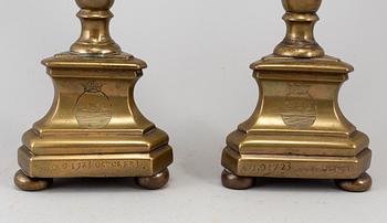 A pair of 17th century bronze candlesticks.