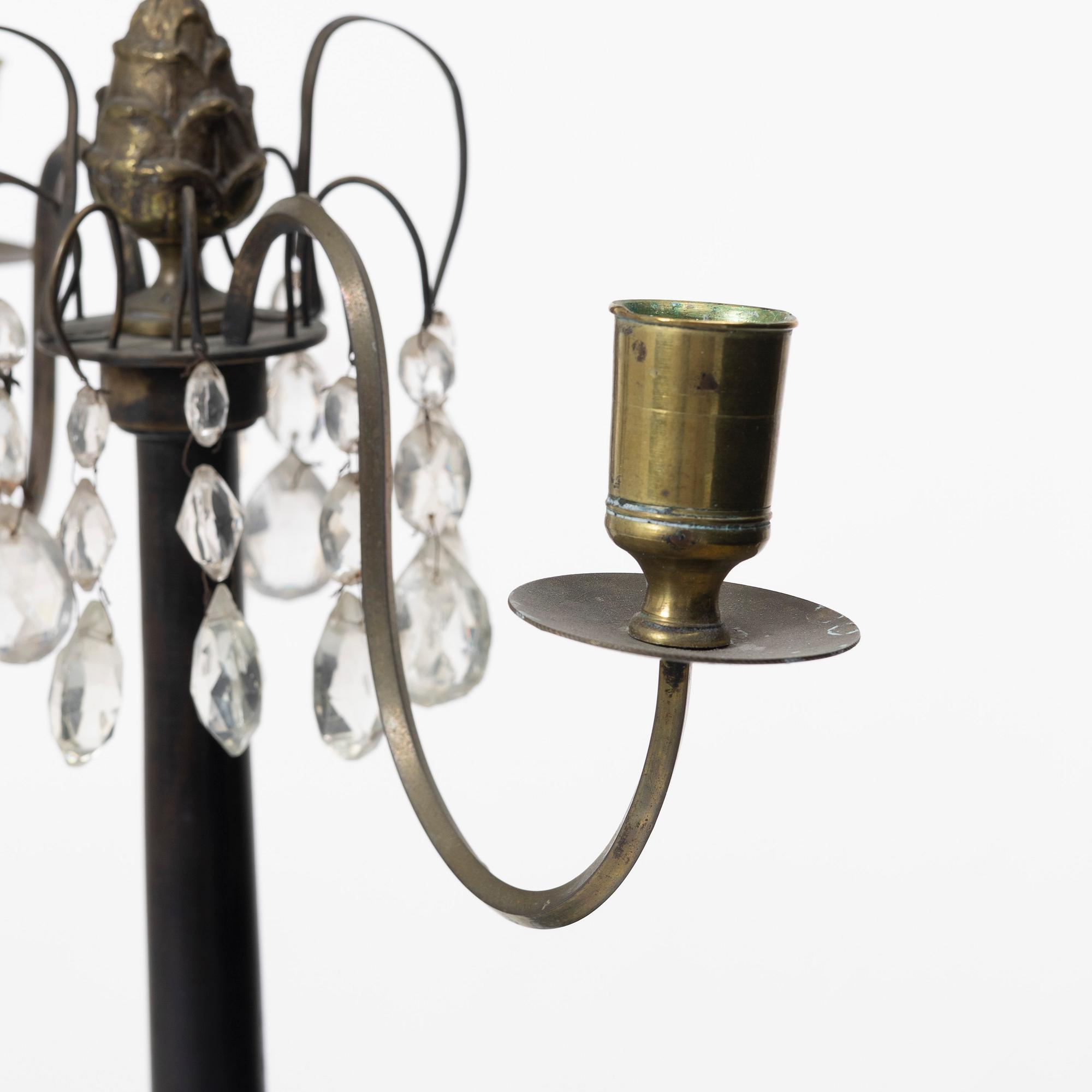 A pair of wooden candelabras, around 1900.