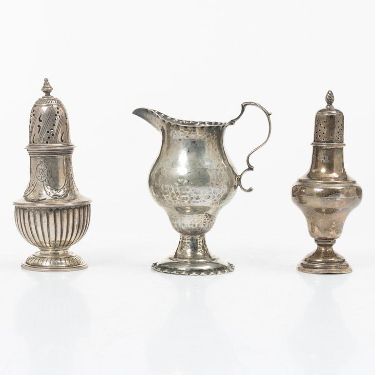 Two silver casters and cream jug, England.