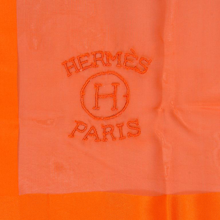 A silk scarf by Hermès.