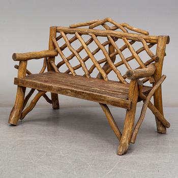 A garden sofa, table, bench and a pair of chairs, first half of the 20th century.