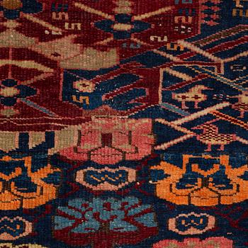 An antique Kuba rug, c. 128-133 x 103 cm.