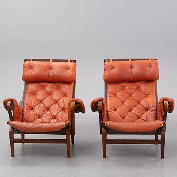 An end of the 20th Century pair of 'Pernilla' easy chairs with leather upholstery by Bruno Mathsson for DUX.