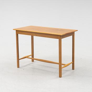 Josef Frank, a model 1106 walnut table, Firma Svenskt Tenn, Sweden.