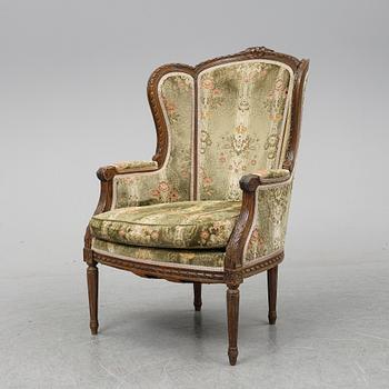 A Louis XVI style armchair from around year 1900-.