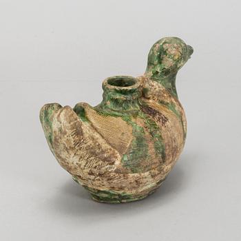 A green and yellow glazed bisquit duckshaped ewer, Ming dynasty (1368-1644).