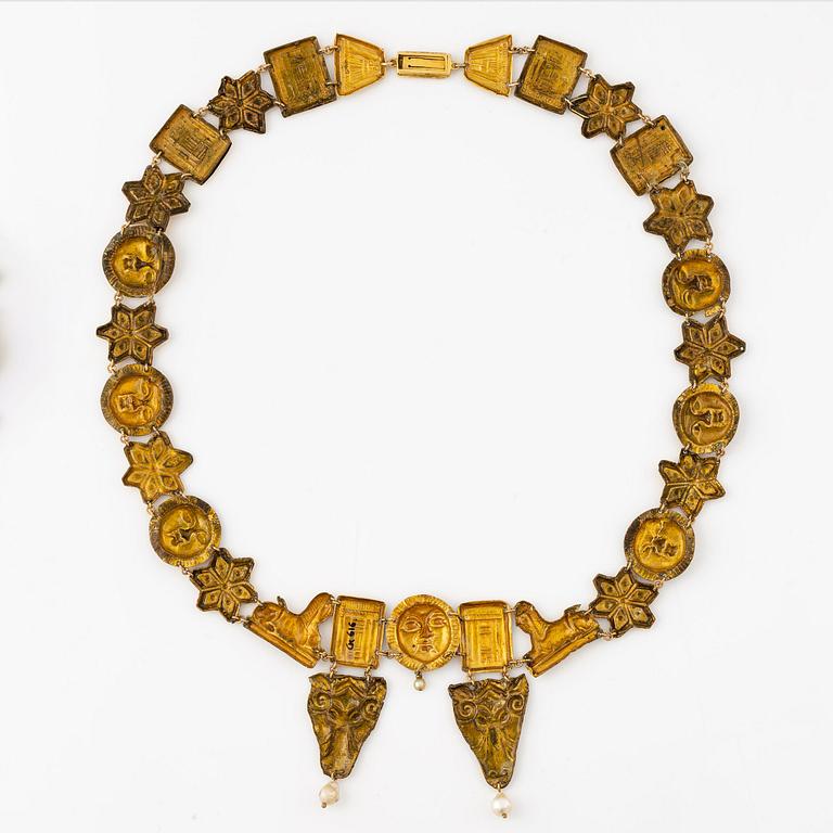 A modern Egyptian-style gold and pearl necklace.