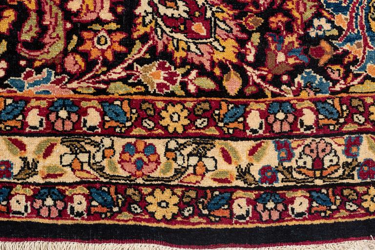 A semi-antique Semnan carpet, North Persia, c. 412 x 304 cm.