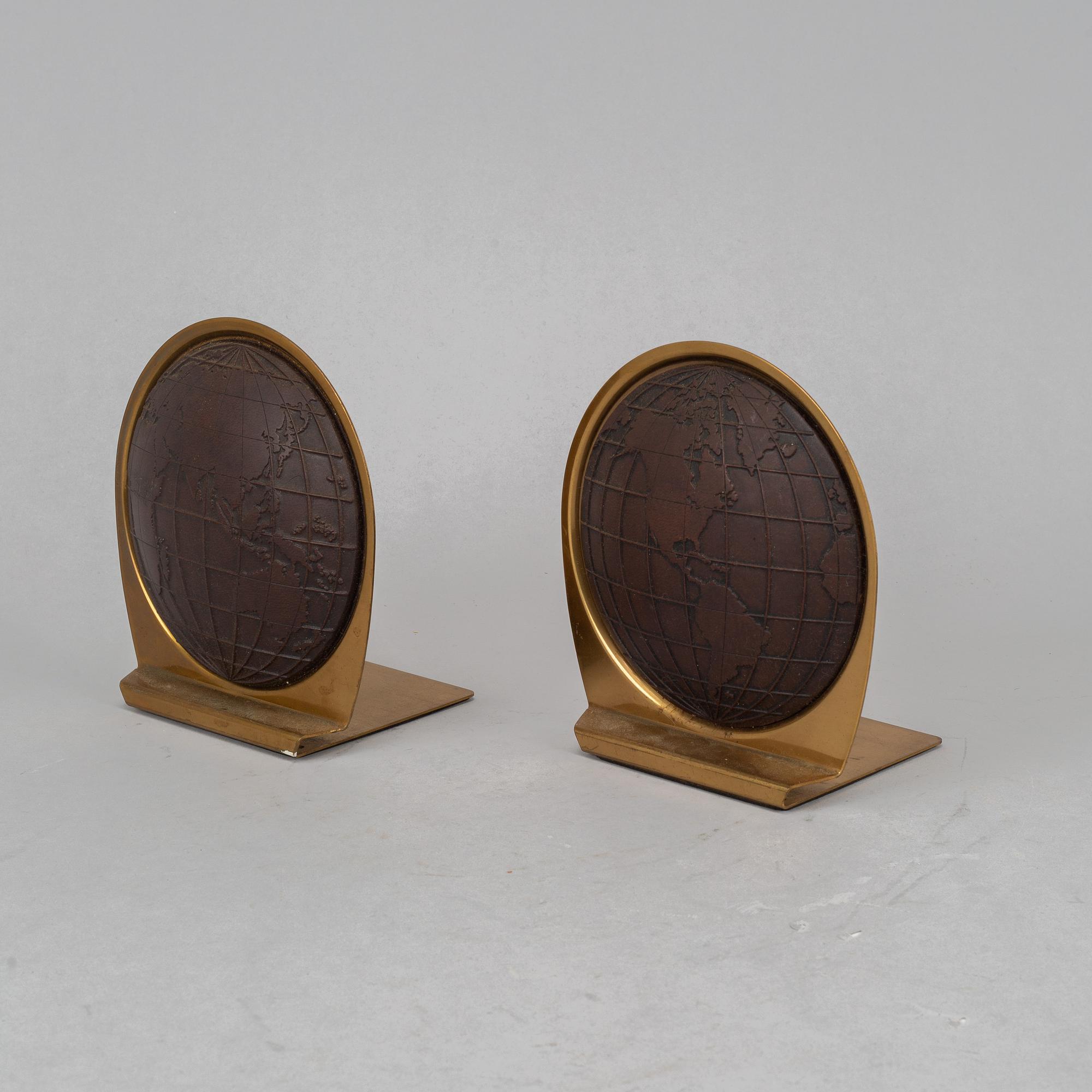 A pair of brass book ends, mid 20th century.