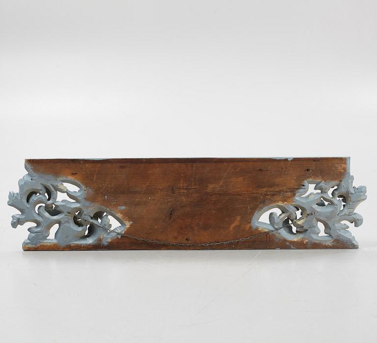 A carved and painted door overpiece, 18th century comprising 20th century elements.