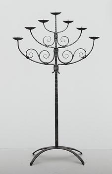 GOLVLJUSSTAKE, smide, 1900-talets mitt.