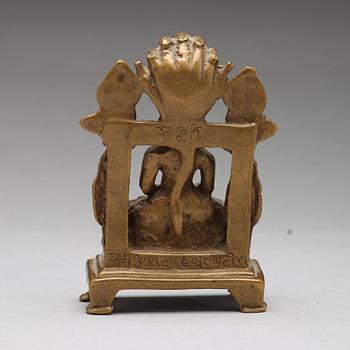 A copper alloy Jain shrine, western India, 19th Century or older. With inscription to the back.
