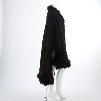 YVES SAINT LAURENT, a black wool and brown fur trimmed cape.