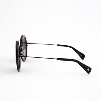 A pair of Yohji Yamamoto sunglasses.
