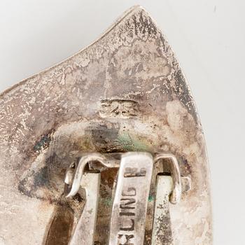Earrings, silver, in the form of stylised leaves.