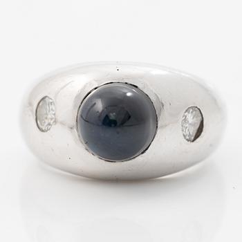 Ring, 18K white gold, set with brilliant-cut diamonds and a cabochon-cut sapphire.