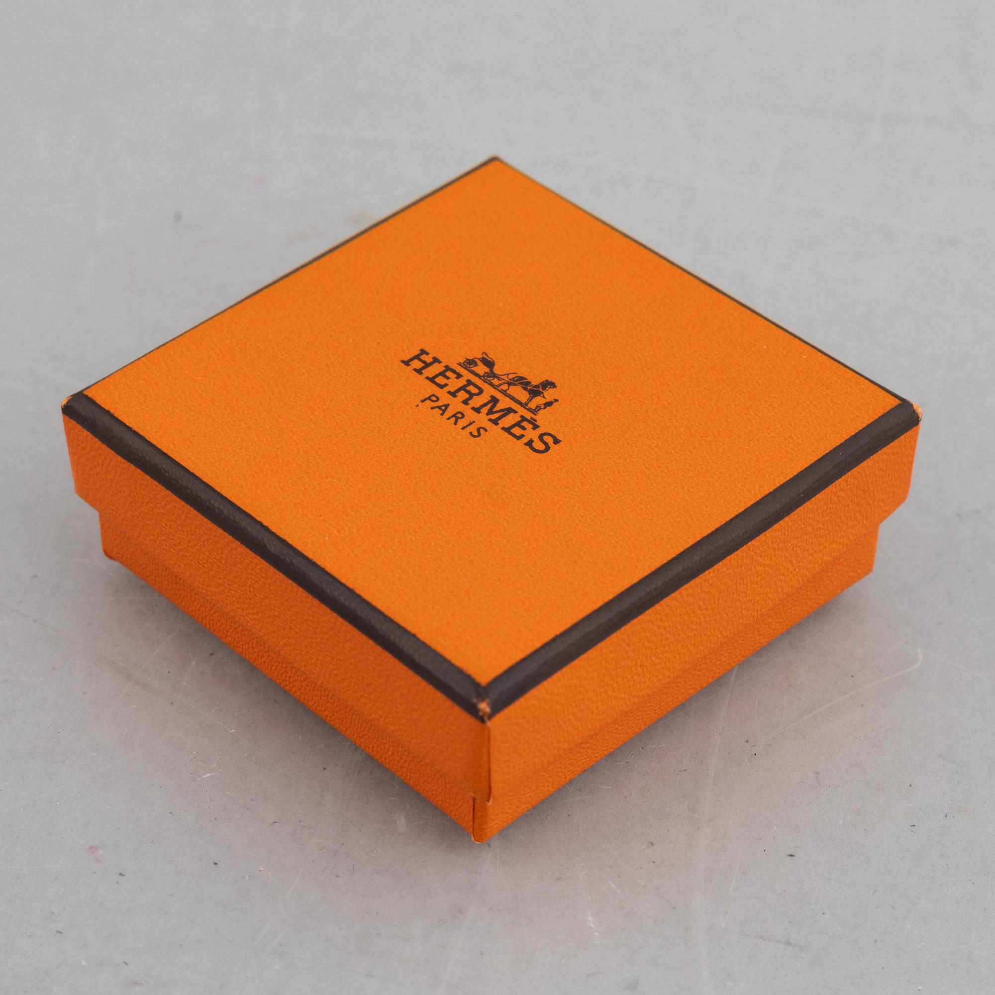 Hermès, a scarf ring.