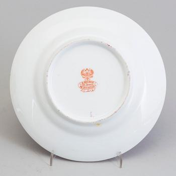 12 Russian porcelain Kuznetsov plates, probably for the Iranian market, late 19th century.