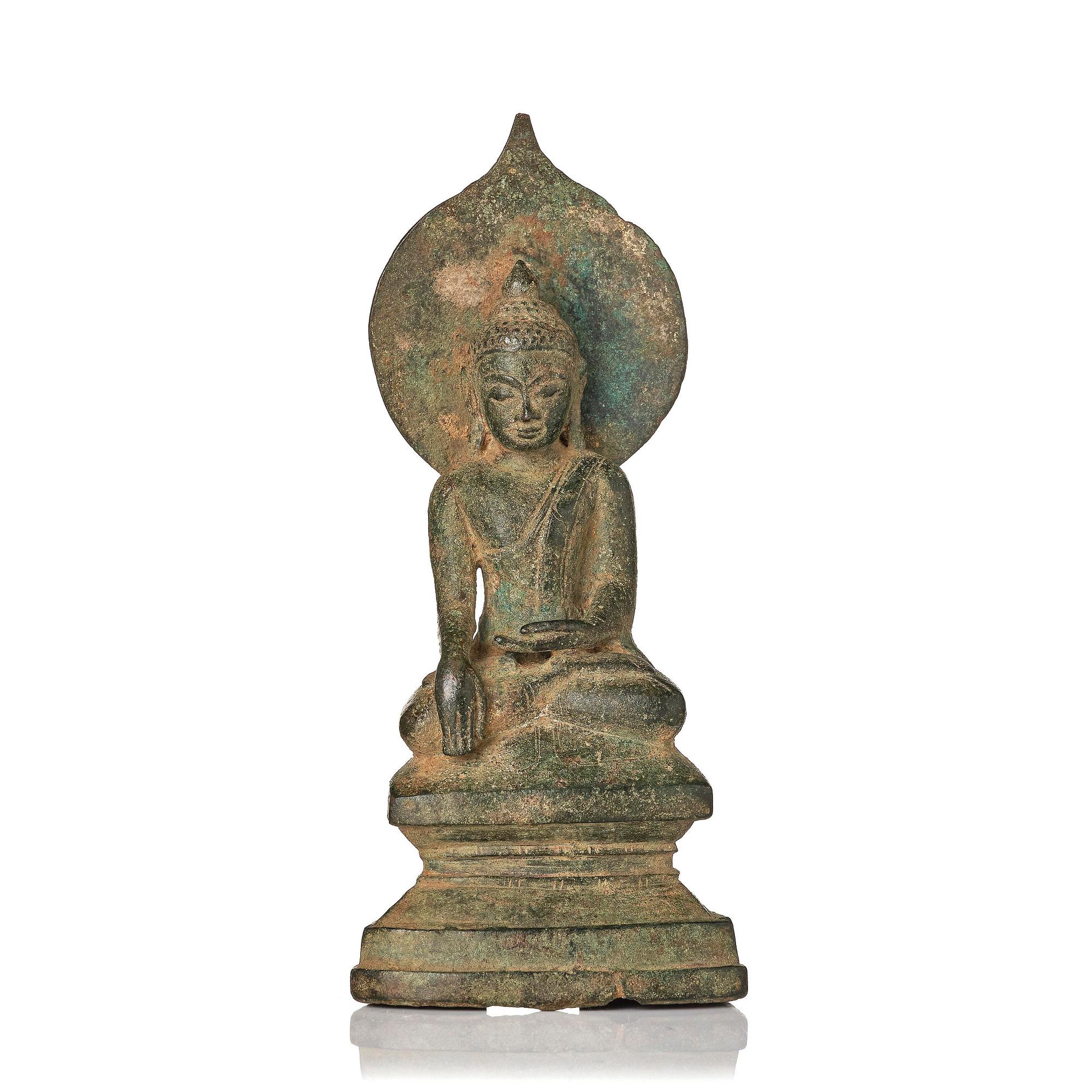 A bronze figure of Buddha with a halo, Burma, 16th century.