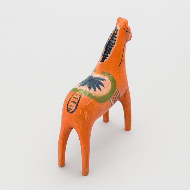 A painted folk art dala horse first half of the 20th century.