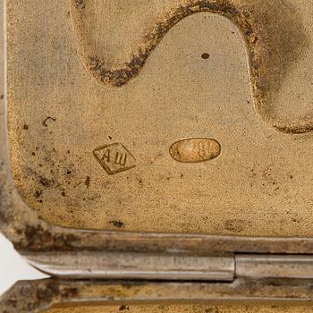 A silver cigarette case, Moscow, dated 1916.