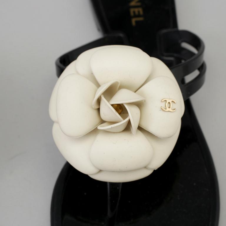 CHANEL, a pair of black plastic sandals. Size 38.