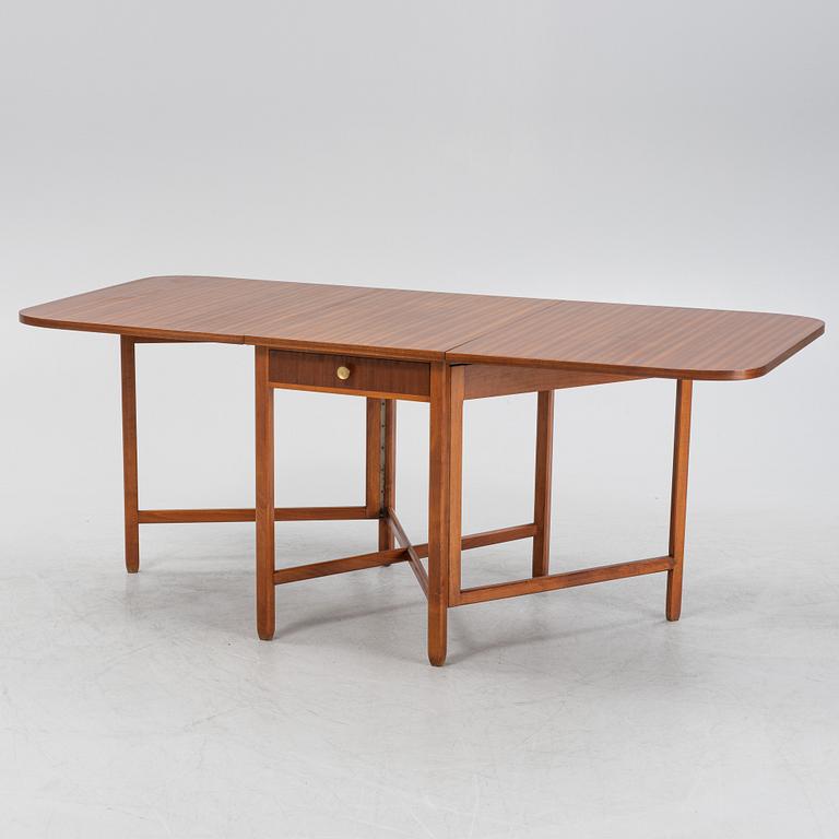 A mahogany veneered gate-leg table, second half of the 20th Century.