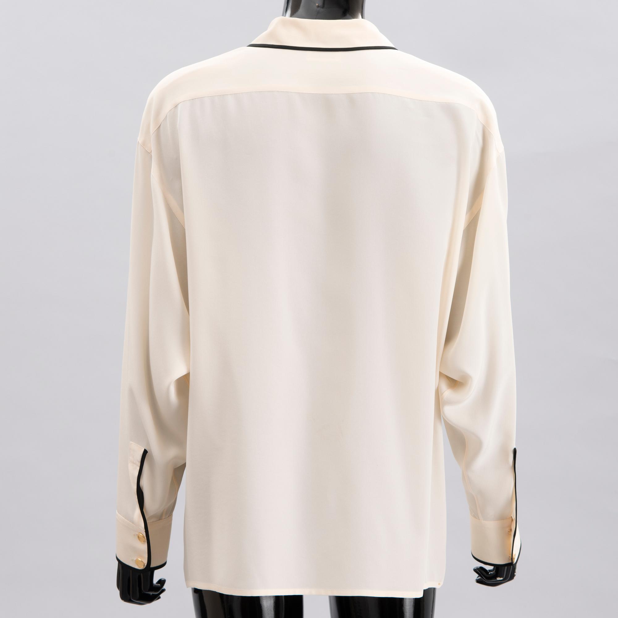 Two Chanel Crepe de Chine Cream Coloured Silk Blouses.